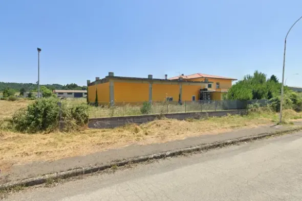#24634 Opificio con abitazione e terreno con residua capacità edificatoria